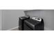 Laundry room featuring dark-colored, high-efficiency washer and dryer sets at 9876 Heather Moore Ave, Las Vegas, NV 89166