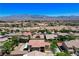 Broad aerial view showcasing a residential community with mature trees, desert landscape, and mountains in the distance at , North Las Vegas, NV 89084