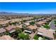 Sweeping aerial view of a neighborhood, highlighting mature landscaping and well-maintained homes, with mountain views at , North Las Vegas, NV 89084