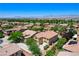 Aerial view of a two-story home showcasing mature landscaping and vibrant tree cover with mountain views at , North Las Vegas, NV 89084