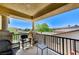 Balcony area with chairs and a small table overlooking trees and other houses at , North Las Vegas, NV 89084