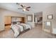 Comfortable bedroom with a ceiling fan and built-in shelving for convenient storage at , North Las Vegas, NV 89084