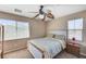Cozy bedroom featuring a full-sized bed, ceiling fan, and a well-lit window at , North Las Vegas, NV 89084