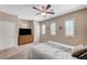Bedroom with a ceiling fan, natural light, and a classic wooden dresser at , North Las Vegas, NV 89084