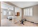 Bright bedroom with a ceiling fan, shuttered windows, and a cozy sitting area at , North Las Vegas, NV 89084
