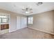 Spacious bedroom with carpet flooring, walk-in closet, and bathroom entrance at , North Las Vegas, NV 89084