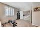 Carpeted bonus room featuring a weights bench, shuttered windows, and neutral walls at , North Las Vegas, NV 89084