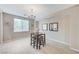 Comfortable dining area with natural light, modern chandelier, and seating for up to four at , North Las Vegas, NV 89084