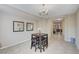 Cozy dining area with chandelier, seating for four, and easy access to additional rooms at , North Las Vegas, NV 89084