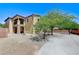 Exterior angle view of a two-story home showing second story deck and desert landscaping at , North Las Vegas, NV 89084