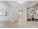 Warm, neutral foyer featuring tile flooring and archways leading to various rooms at , North Las Vegas, NV 89084