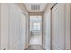 Hallway with closet doors that leads to bathroom with soaking tub at , North Las Vegas, NV 89084