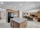 Spacious kitchen with stainless steel appliances, granite counters, large island, and tile flooring at , North Las Vegas, NV 89084