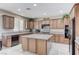 Well-appointed kitchen with granite countertops, a central island, and modern appliances with neutral colors at , North Las Vegas, NV 89084