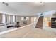 Open-concept living room with tile flooring, fireplace, and staircase at , North Las Vegas, NV 89084