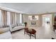 Inviting living room with tile floors, a fireplace, and access to the dining area at , North Las Vegas, NV 89084
