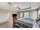 Spacious main bedroom with carpet floors, ceiling fan, and doors to the backyard at , North Las Vegas, NV 89084