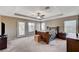 Spacious main bedroom with carpet floors, ceiling fan, and doors to the backyard at , North Las Vegas, NV 89084