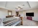 Spacious main bedroom with carpet floors, ceiling fan, and doors to the backyard at , North Las Vegas, NV 89084
