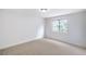 Bedroom featuring neutral carpeting and a window offering natural light at 10009 Coral Sands Dr, Las Vegas, NV 89117