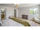 Bright main bedroom featuring a walk-in closet and windows with a scenic view at 10009 Coral Sands Dr, Las Vegas, NV 89117