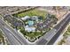 Stunning aerial shot showcases the community park with a pool, field, and recreational area at 10116 Skye Castle Dr, Las Vegas, NV 89166