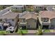 Aerial view of backyard showing the balcony, artificial grass and covered patio at 10116 Skye Castle Dr, Las Vegas, NV 89166
