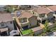 Aerial view of backyard showing the balcony, artificial grass and covered patio at 10116 Skye Castle Dr, Las Vegas, NV 89166