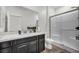 Modern bathroom with sleek vanity, a spacious shower, and a toilet at 10116 Skye Castle Dr, Las Vegas, NV 89166