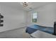 Bedroom featuring a comfortable bed, window, and neutral walls at 10116 Skye Castle Dr, Las Vegas, NV 89166