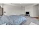 Cozy bedroom with plush carpeting, TV, and soft, inviting bedding at 10116 Skye Castle Dr, Las Vegas, NV 89166