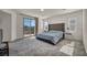 Bright bedroom featuring a large bed and a private balcony with views at 10116 Skye Castle Dr, Las Vegas, NV 89166