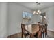 Dining area with hardwood floors and natural light from a window at 10116 Skye Castle Dr, Las Vegas, NV 89166