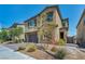 Two-story home boasts a neutral color palette, stone accents, solar panels and a two-car garage at 10116 Skye Castle Dr, Las Vegas, NV 89166