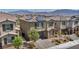 Charming home boasts a paver driveway, shutters, two-car garage, and well-maintained landscaping at 10116 Skye Castle Dr, Las Vegas, NV 89166
