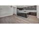 Spacious kitchen with dark cabinets, an island, and stainless appliances at 10116 Skye Castle Dr, Las Vegas, NV 89166