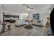 Bright living room features two couches, hardwood floors, and an open floor plan at 10116 Skye Castle Dr, Las Vegas, NV 89166