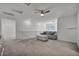 Upstairs loft features neutral carpet and a comfortable seating area at 10116 Skye Castle Dr, Las Vegas, NV 89166