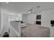 Bright loft area with neutral carpet and view from top of stairs at 10116 Skye Castle Dr, Las Vegas, NV 89166