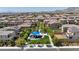 Neighborhood park featuring green spaces and a play area under a blue canopy at 10116 Skye Castle Dr, Las Vegas, NV 89166