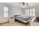 This bedroom features a ceiling fan, shutters, and tile flooring at 1017 Pebble Lake St, Henderson, NV 89011