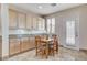 Charming breakfast nook with cabinetry, granite counters, and tile flooring at 1017 Pebble Lake St, Henderson, NV 89011