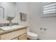 Tastefully designed half bathroom with granite countertop and stylish fixtures at 1017 Pebble Lake St, Henderson, NV 89011