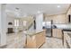 Bright kitchen with island seating, stainless steel appliances, and an open layout at 1017 Pebble Lake St, Henderson, NV 89011