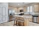 Spacious kitchen boasts granite countertops, stainless appliances, and center island at 1017 Pebble Lake St, Henderson, NV 89011