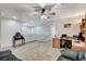 Bright loft space with tile floors, ceiling fan, and staircase access to lower level at 1017 Pebble Lake St, Henderson, NV 89011