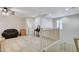 Upstairs loft featuring staircase access, furniture, and tile flooring at 1017 Pebble Lake St, Henderson, NV 89011