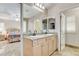 Elegant main bathroom with double vanities, granite counters, and access to the main bedroom at 1017 Pebble Lake St, Henderson, NV 89011