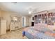 Inviting main bedroom with a personal library and tile floors, offering a cozy retreat at 1017 Pebble Lake St, Henderson, NV 89011