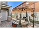 Private patio area featuring a shaded table, grill, and desert decor at 1017 Pebble Lake St, Henderson, NV 89011